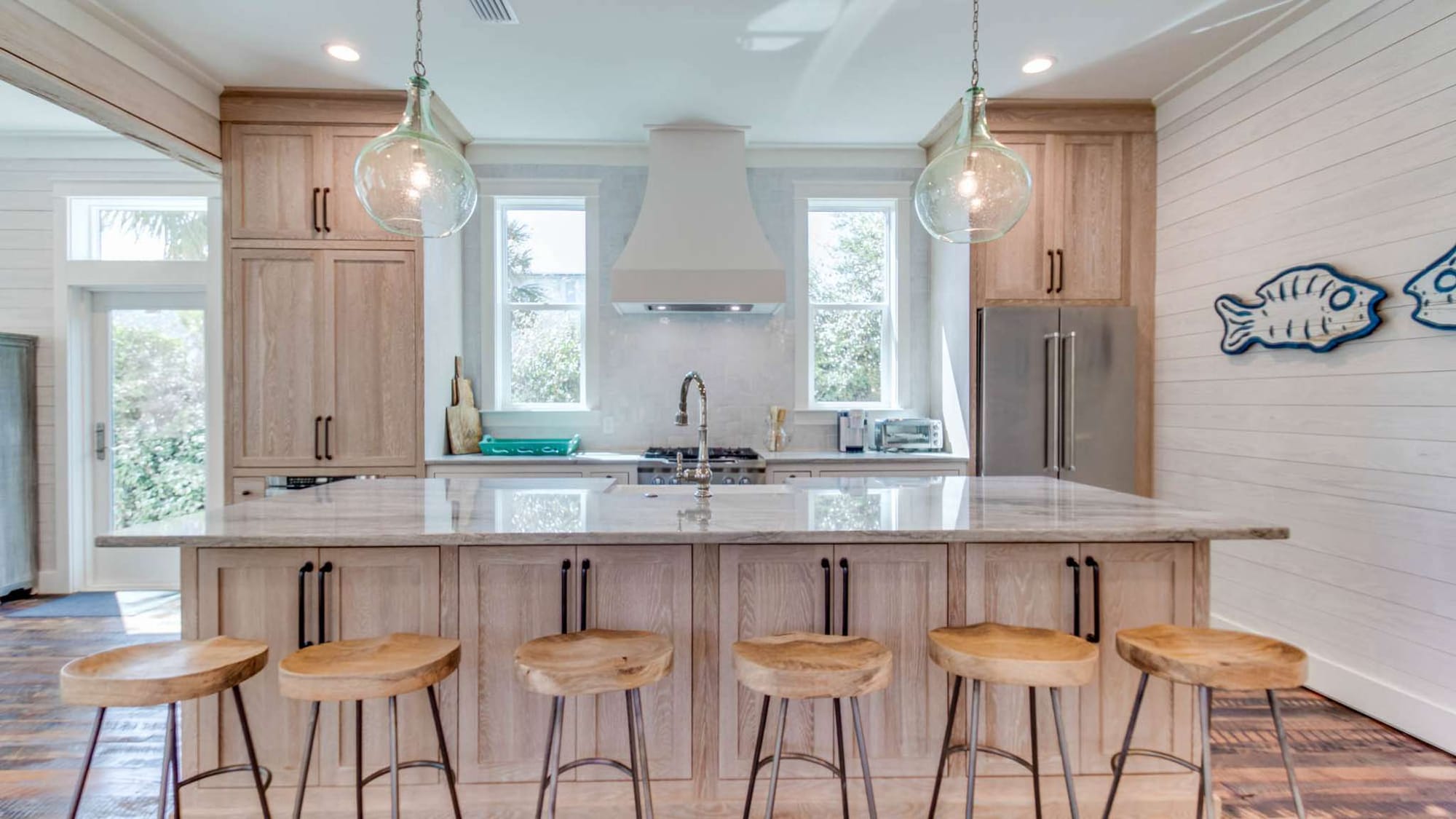 Modern kitchen with wooden stools.