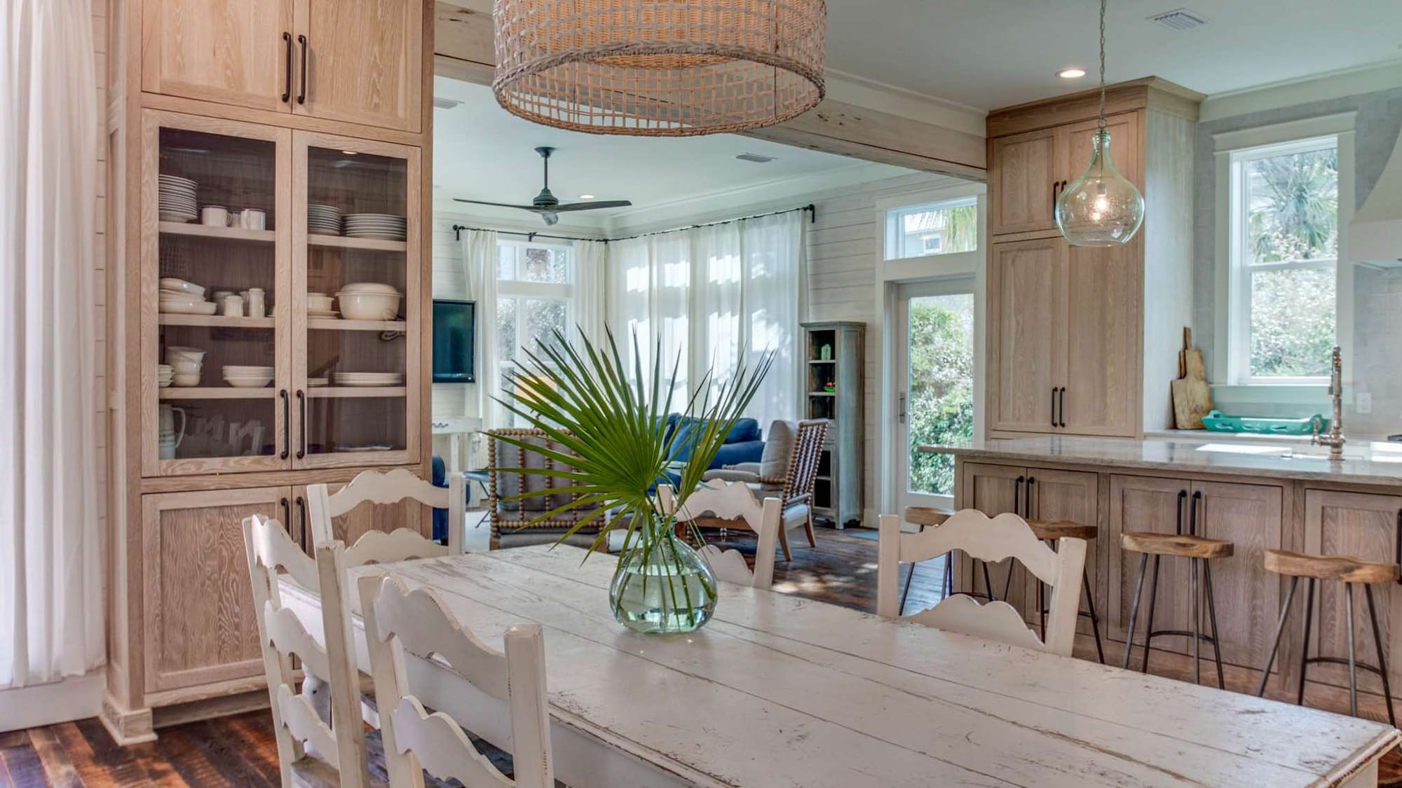 Coastal dining room with kitchen.