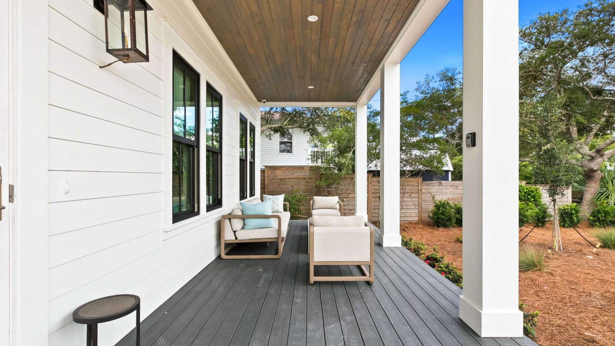 Modern porch with outdoor seating.