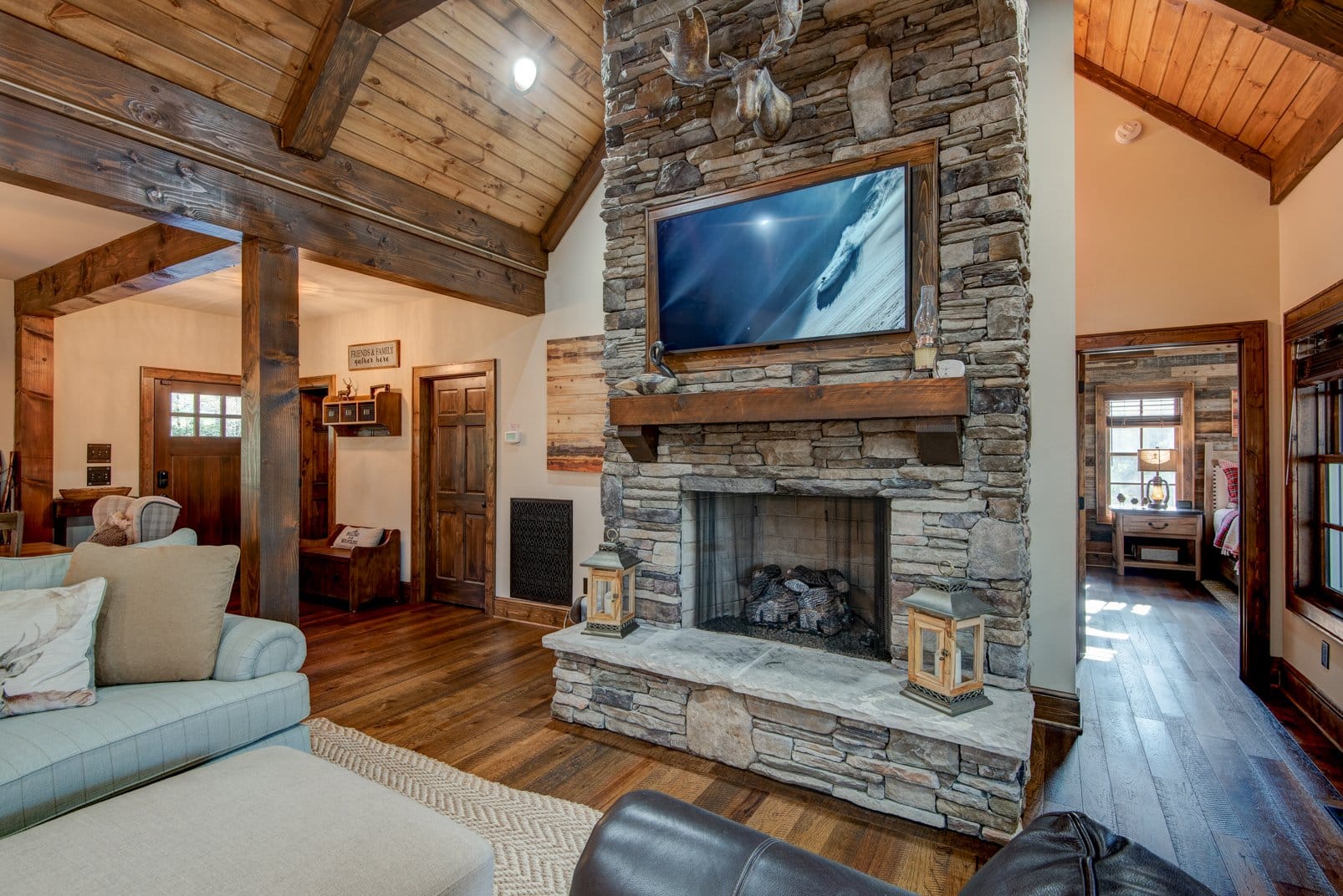 Cozy rustic living room with fireplace.