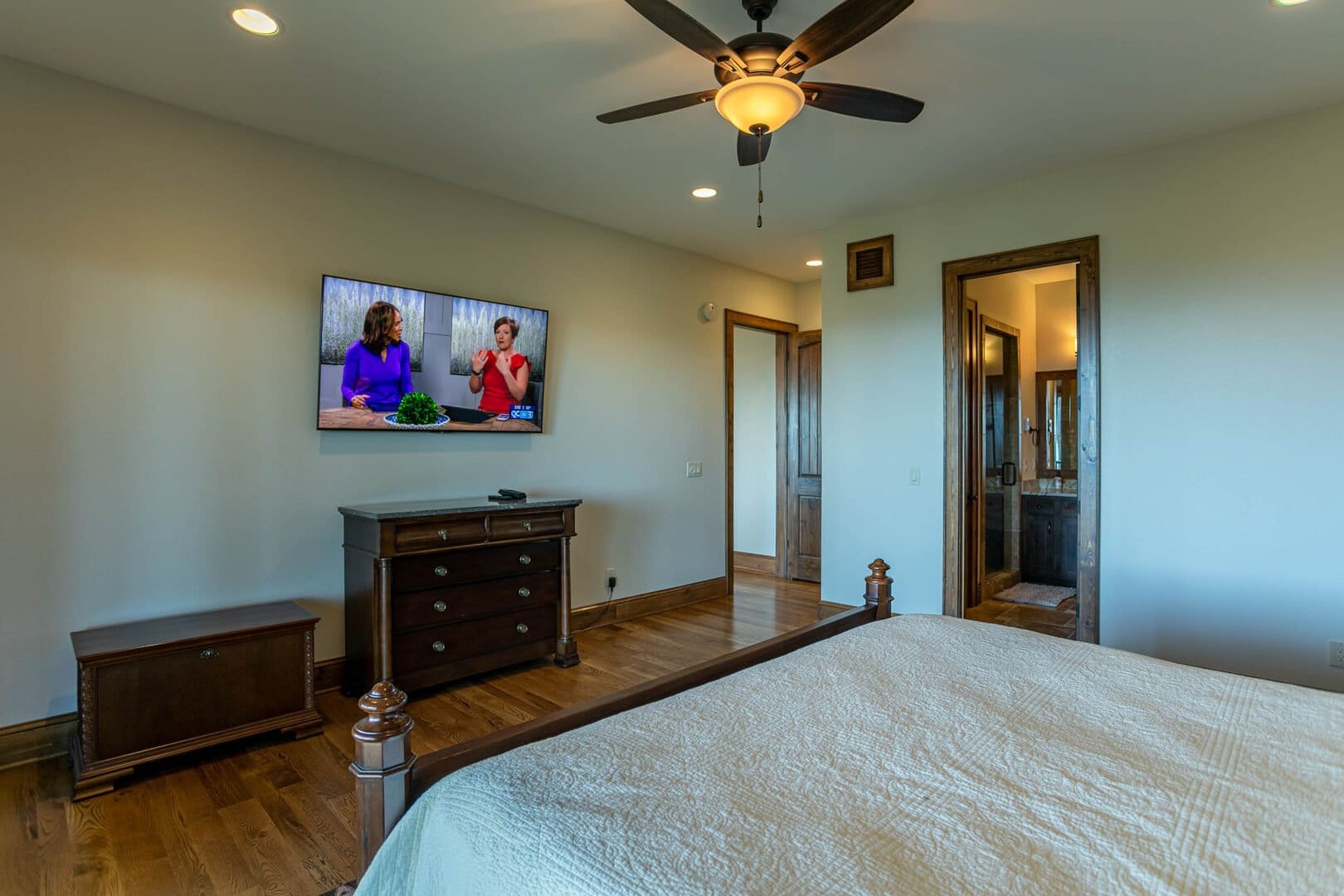 Bedroom with TV and dresser.