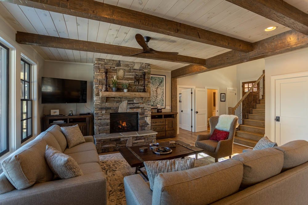 Cozy living room with stone fireplace.