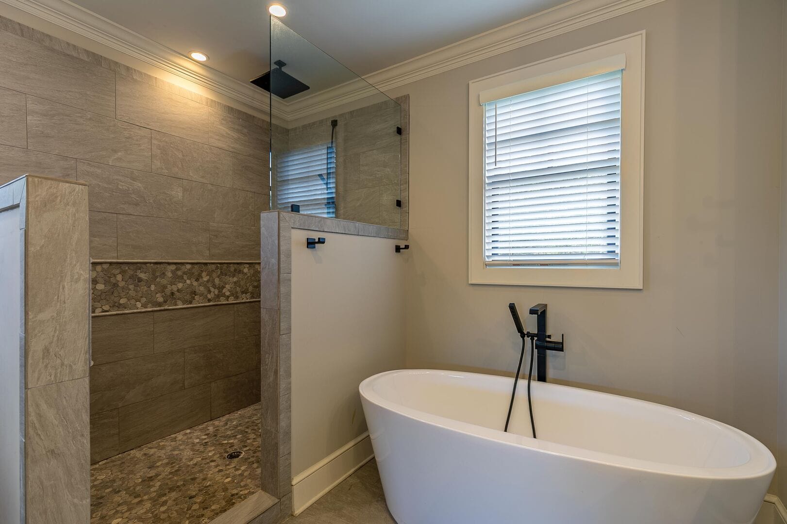 Modern bathroom with shower and tub.