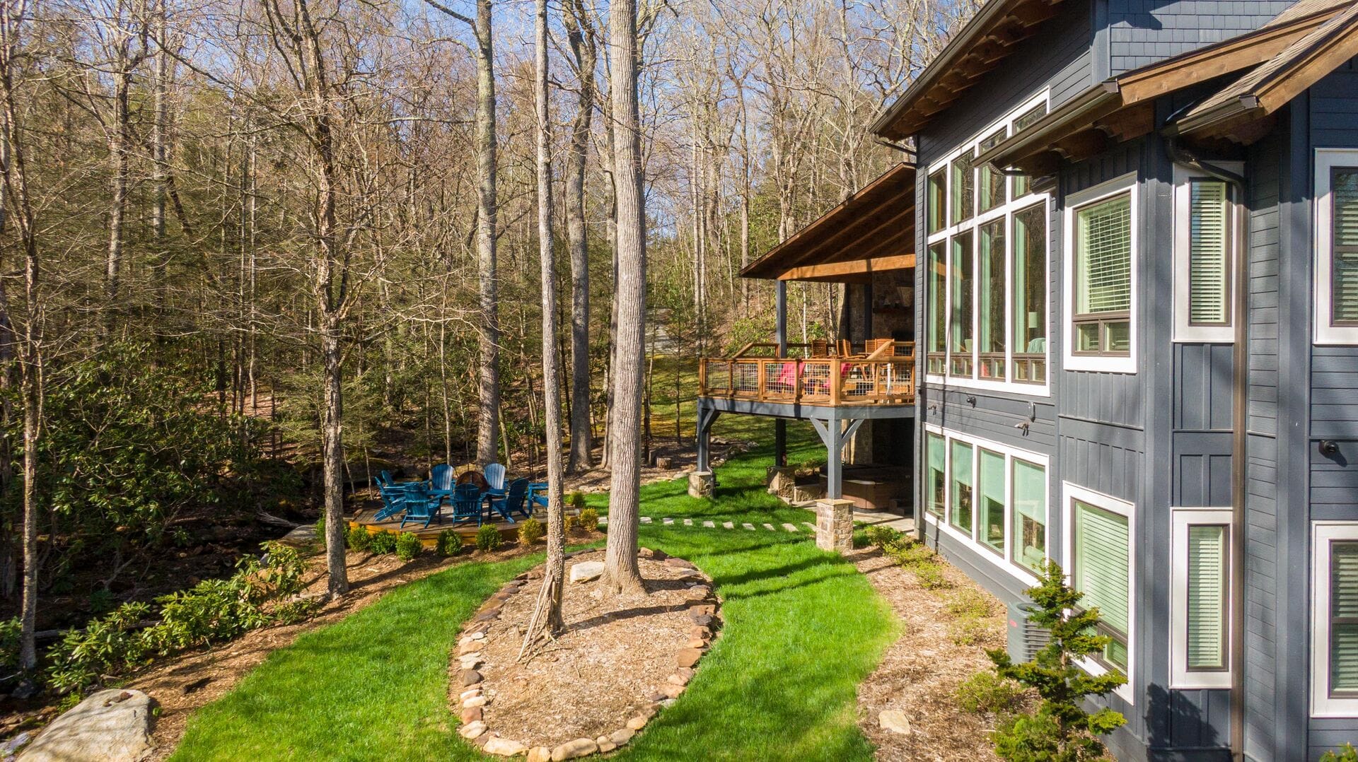 Modern house with forested backyard.