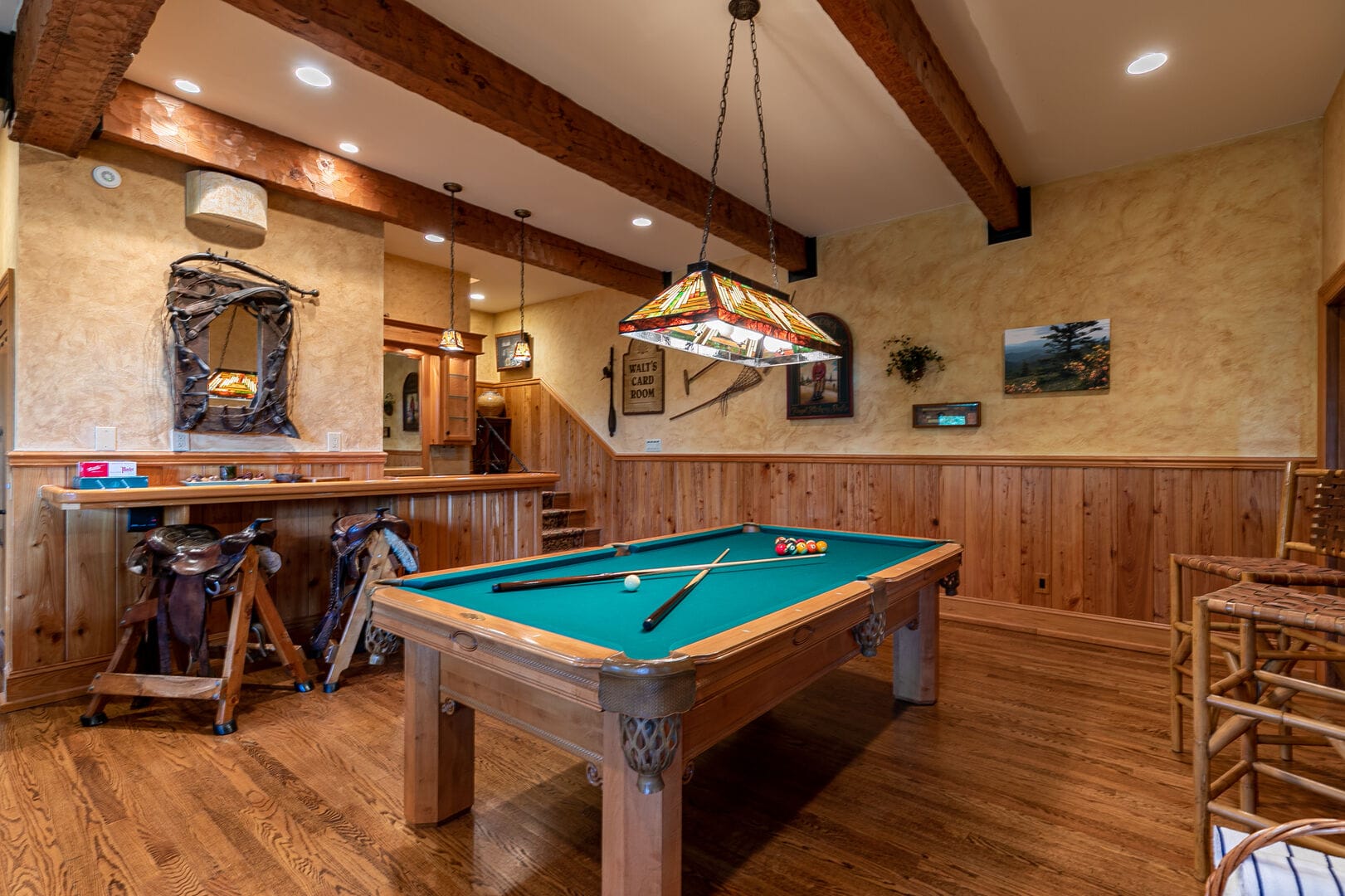 Rustic game room with pool table.