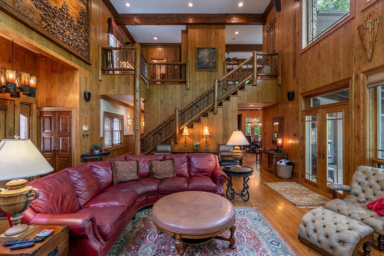 Rustic living room with staircase.