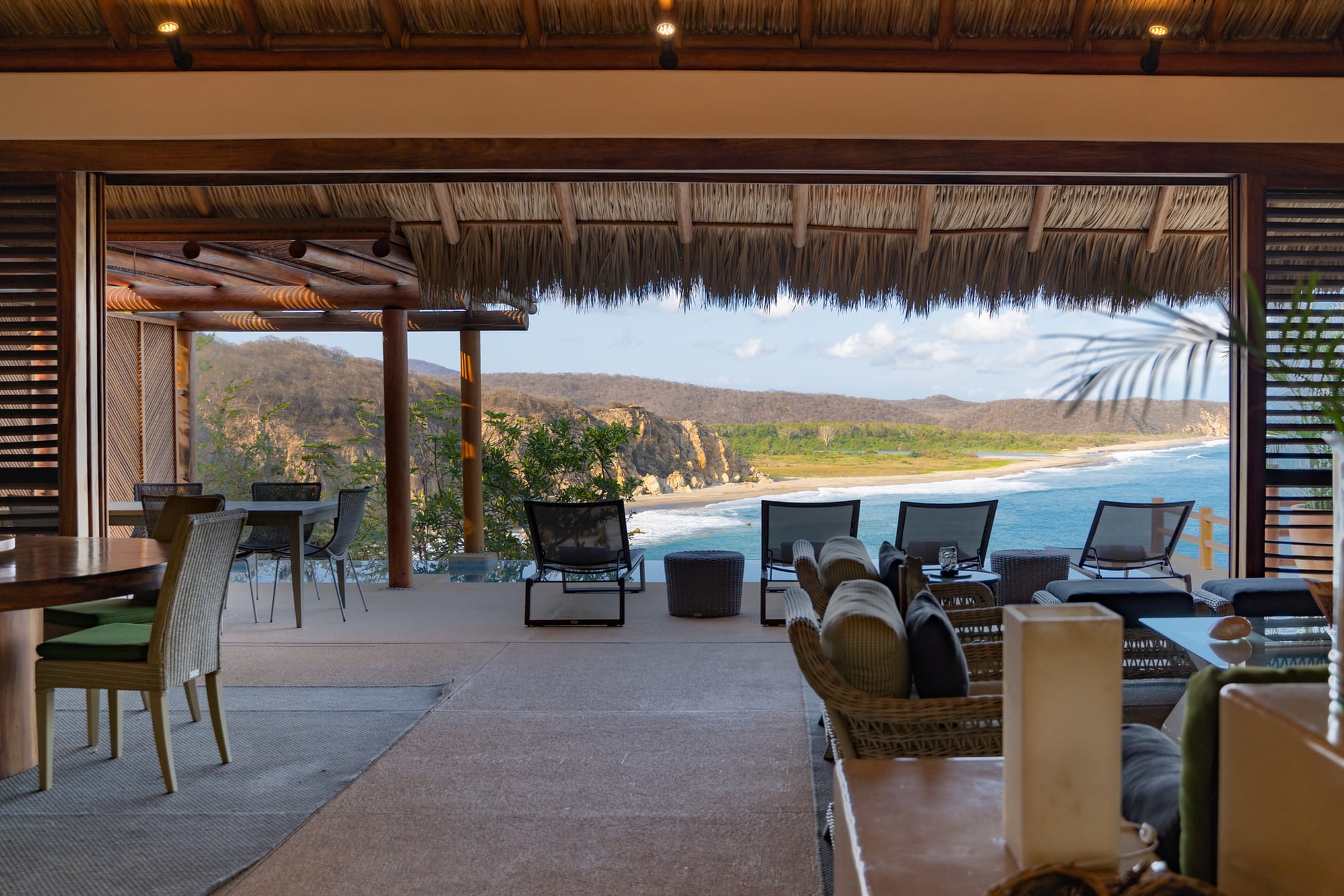 Open-air lounge with ocean view.