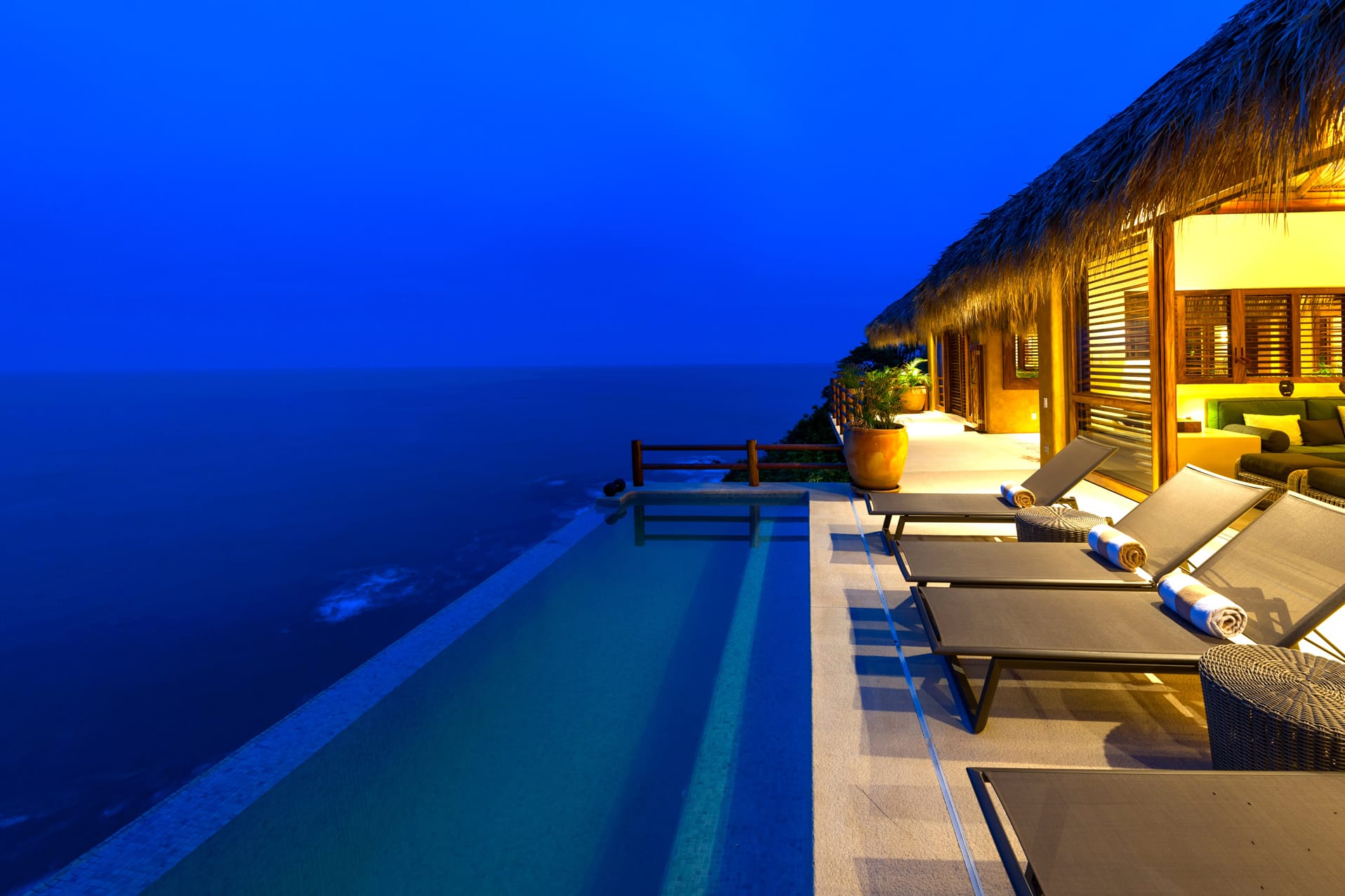 Oceanfront pool at tropical resort.