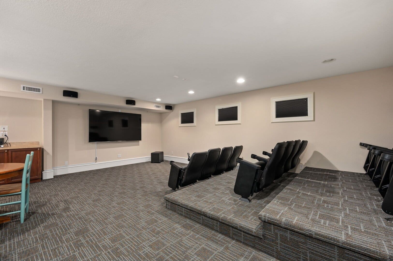 Home theater with tiered seating.