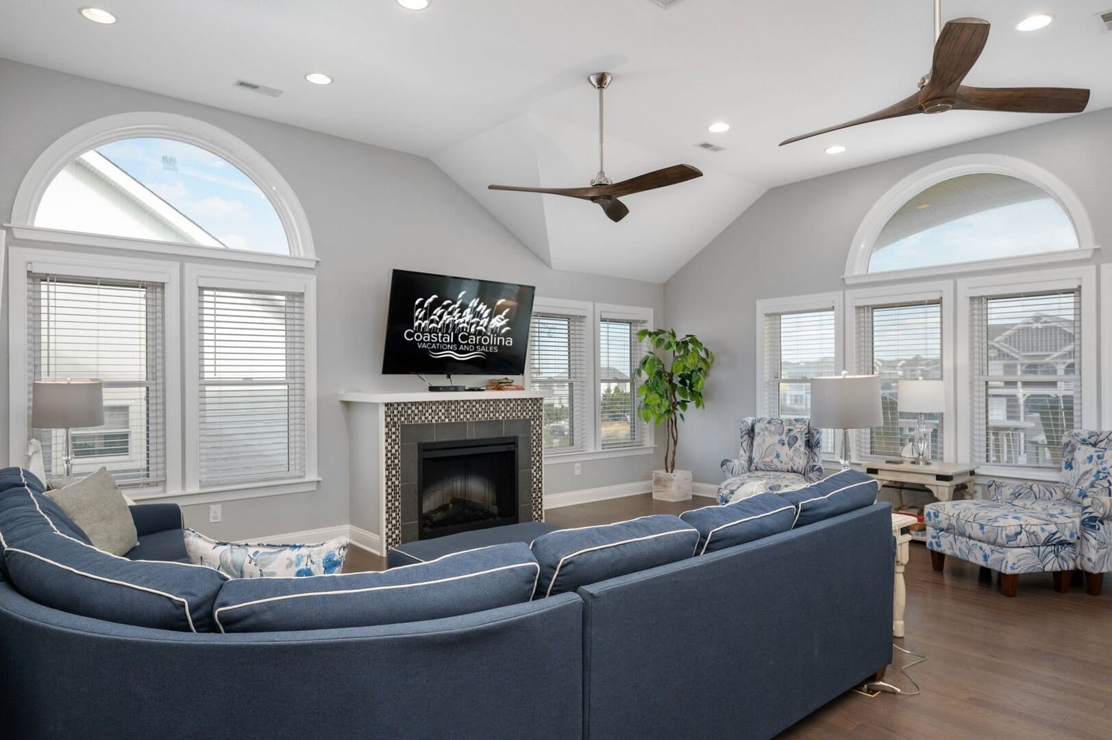 Spacious living room with bay windows.