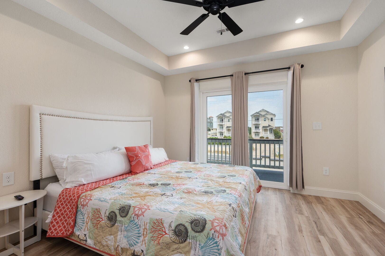 Bedroom with large bed, window.