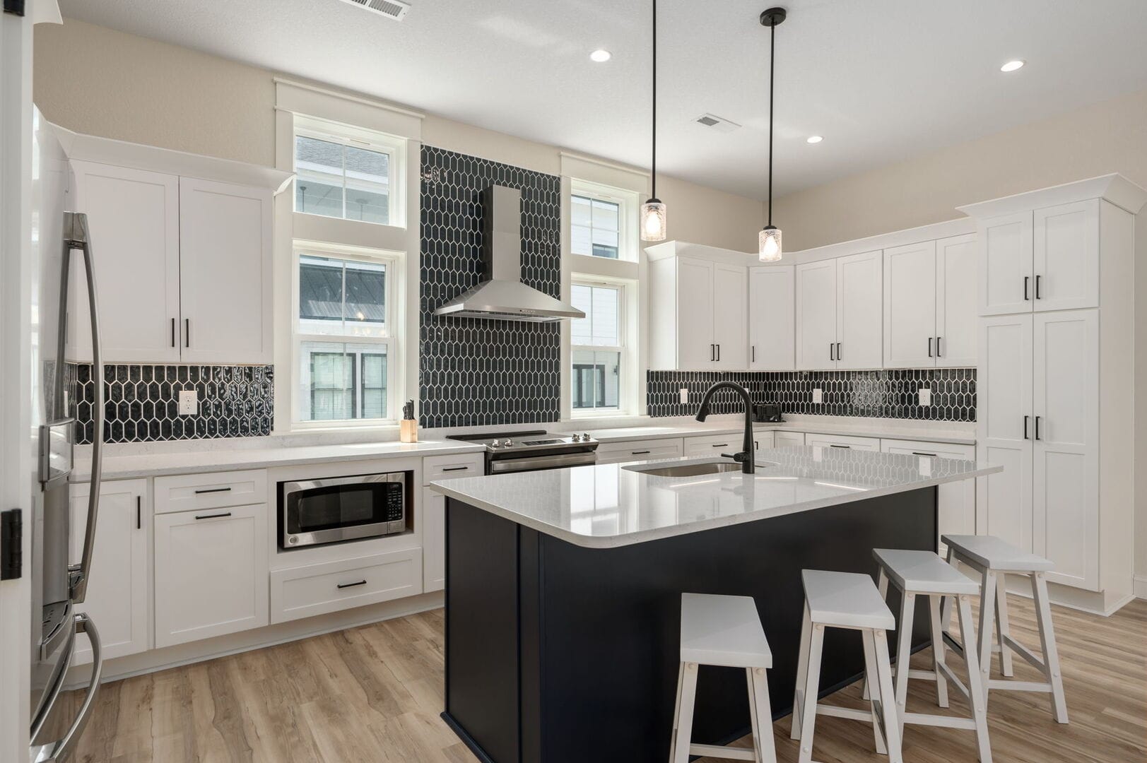 Modern kitchen with black accents.