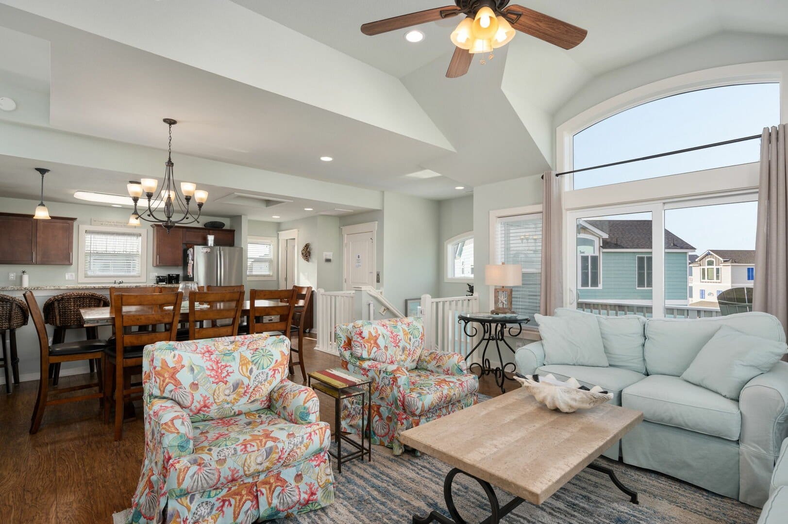 Coastal-themed living and dining area.