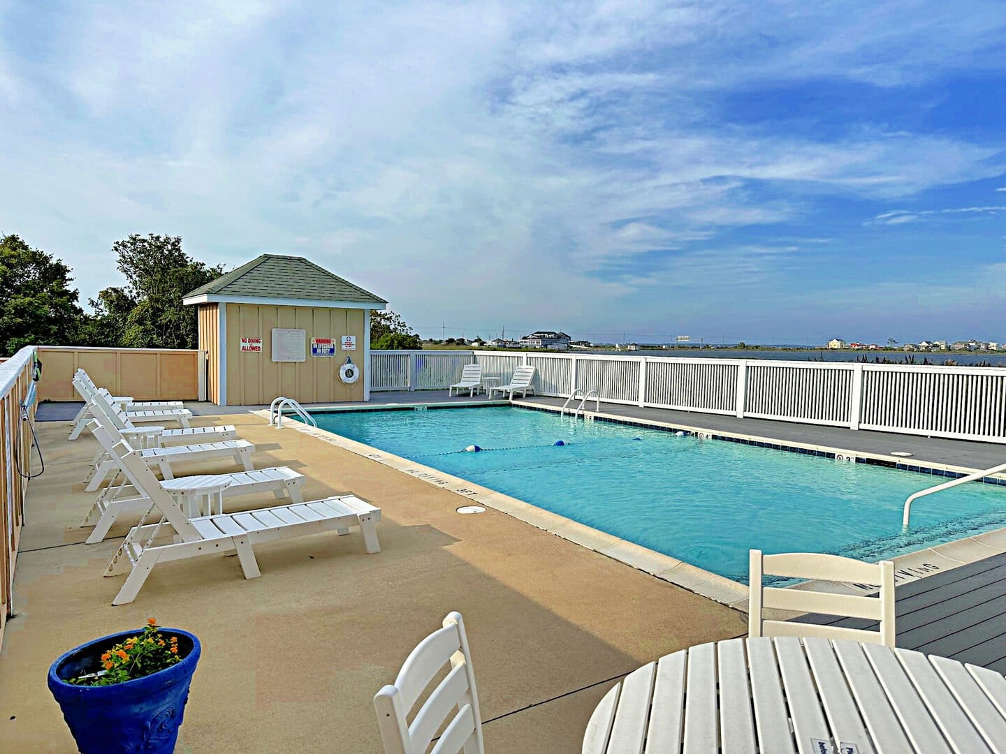 Outdoor pool with lounge chairs.