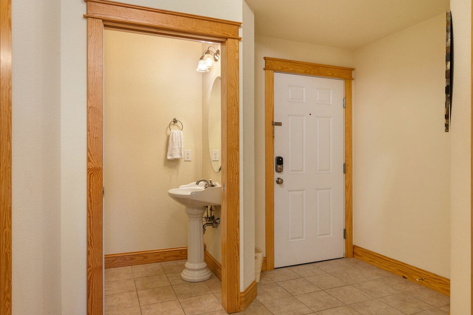 Bathroom entrance near front door.