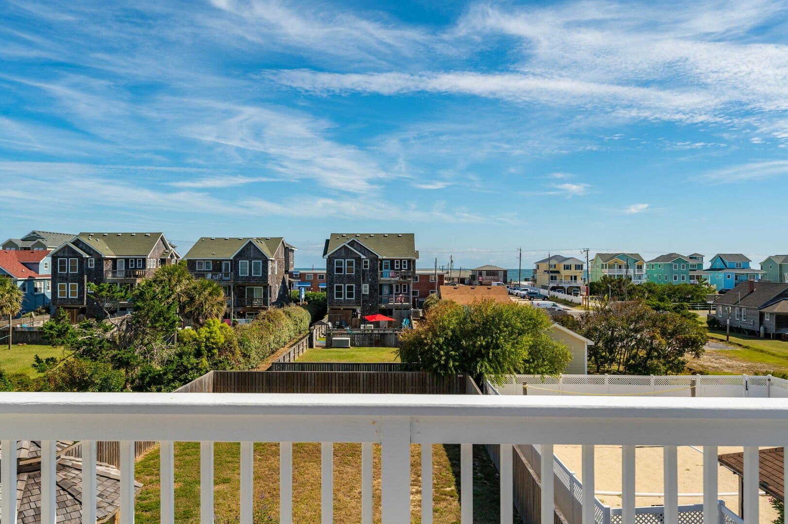 Coastal houses under clear sky.