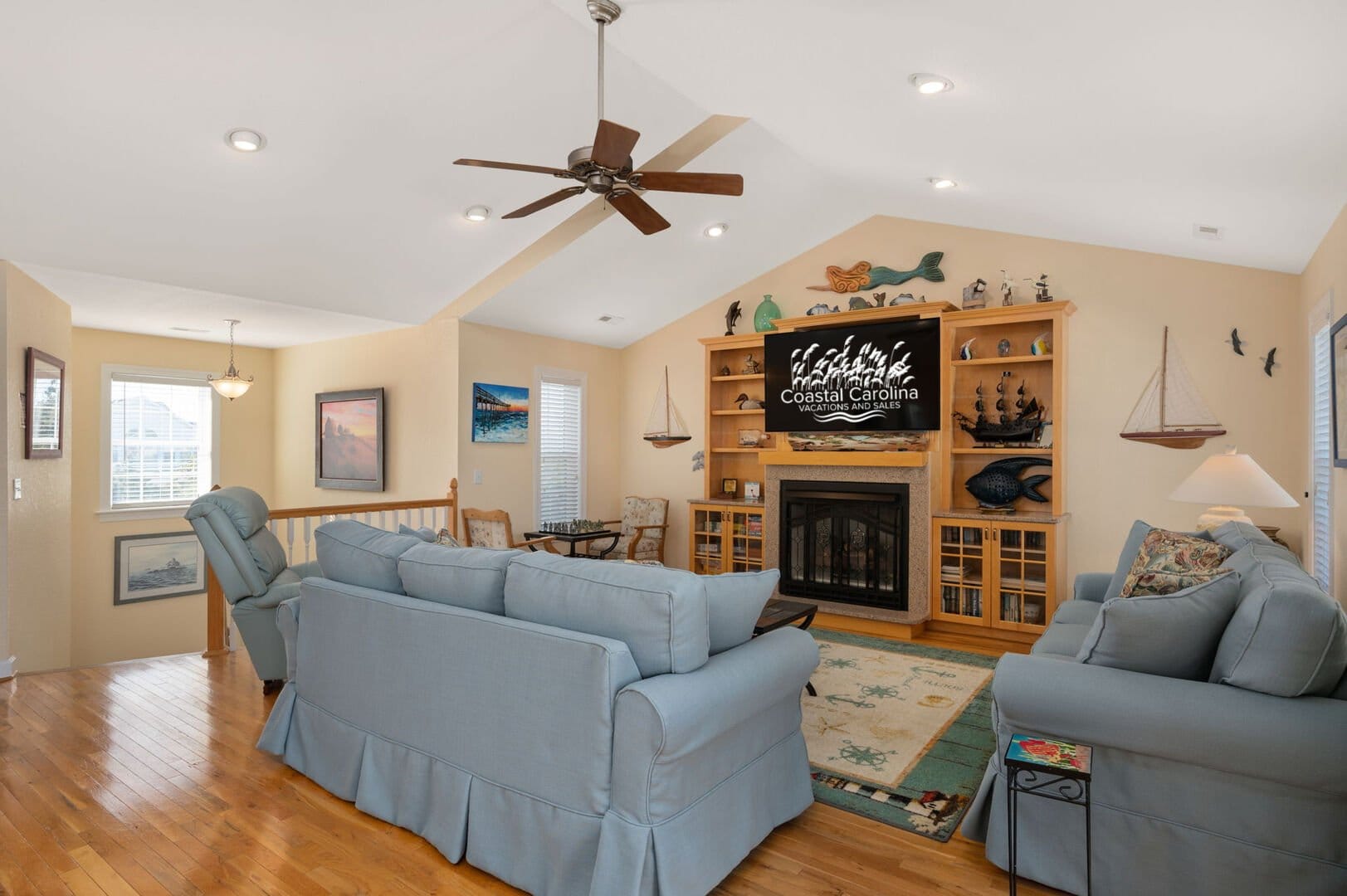 Coastal-themed living room with fireplace.