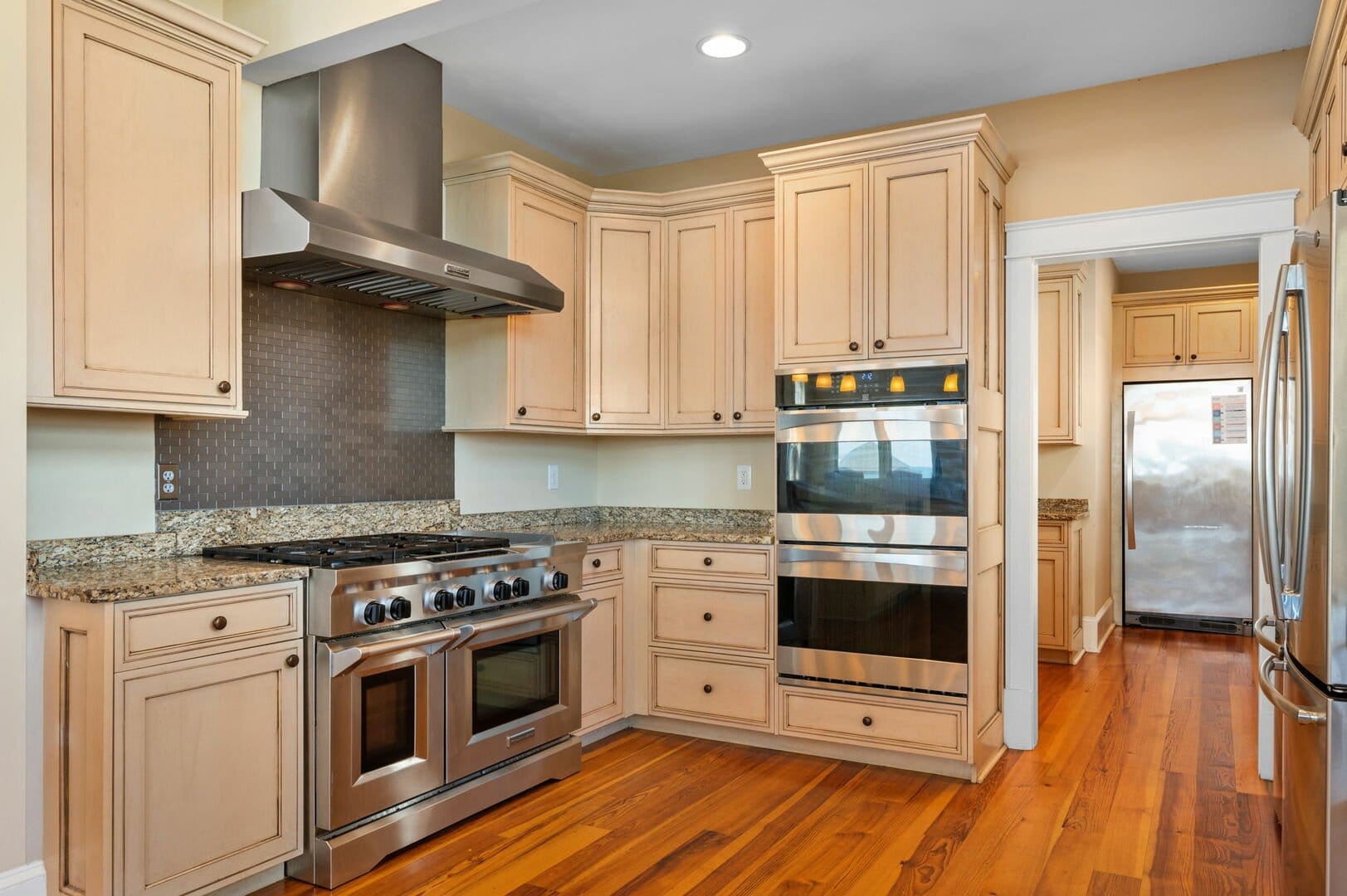 Modern kitchen with stainless steel appliances.