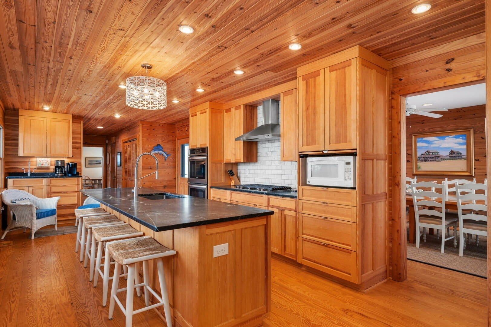 Wooden kitchen with island counter.