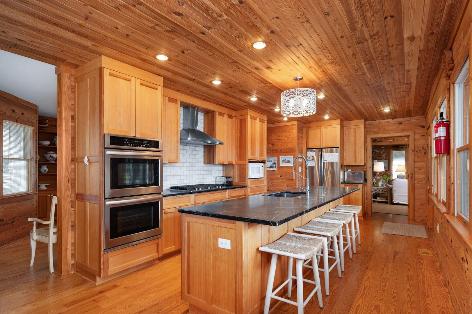 Wooden kitchen with island counter.