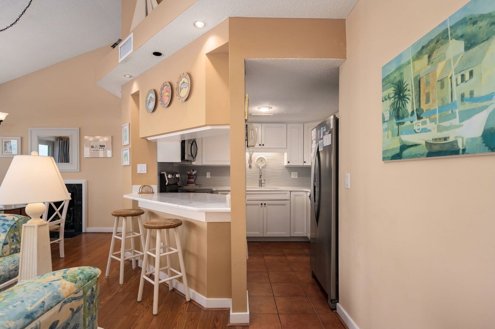 Cozy kitchen with bar stools.