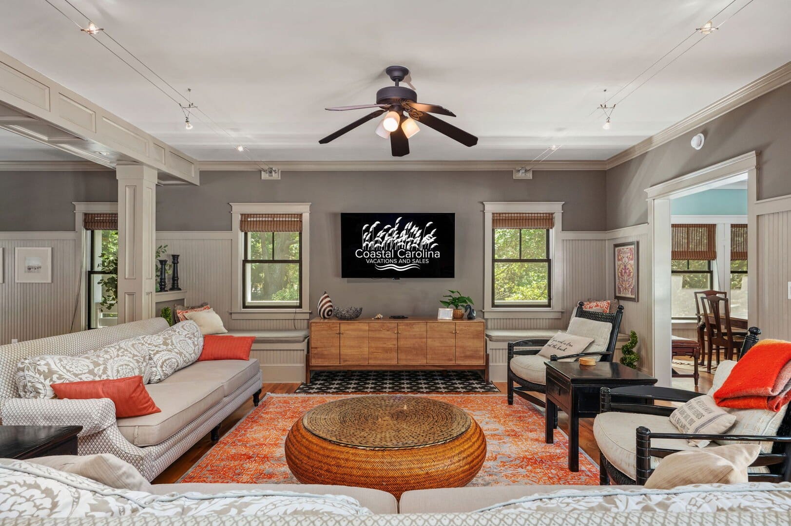 Cozy living room, orange accents.