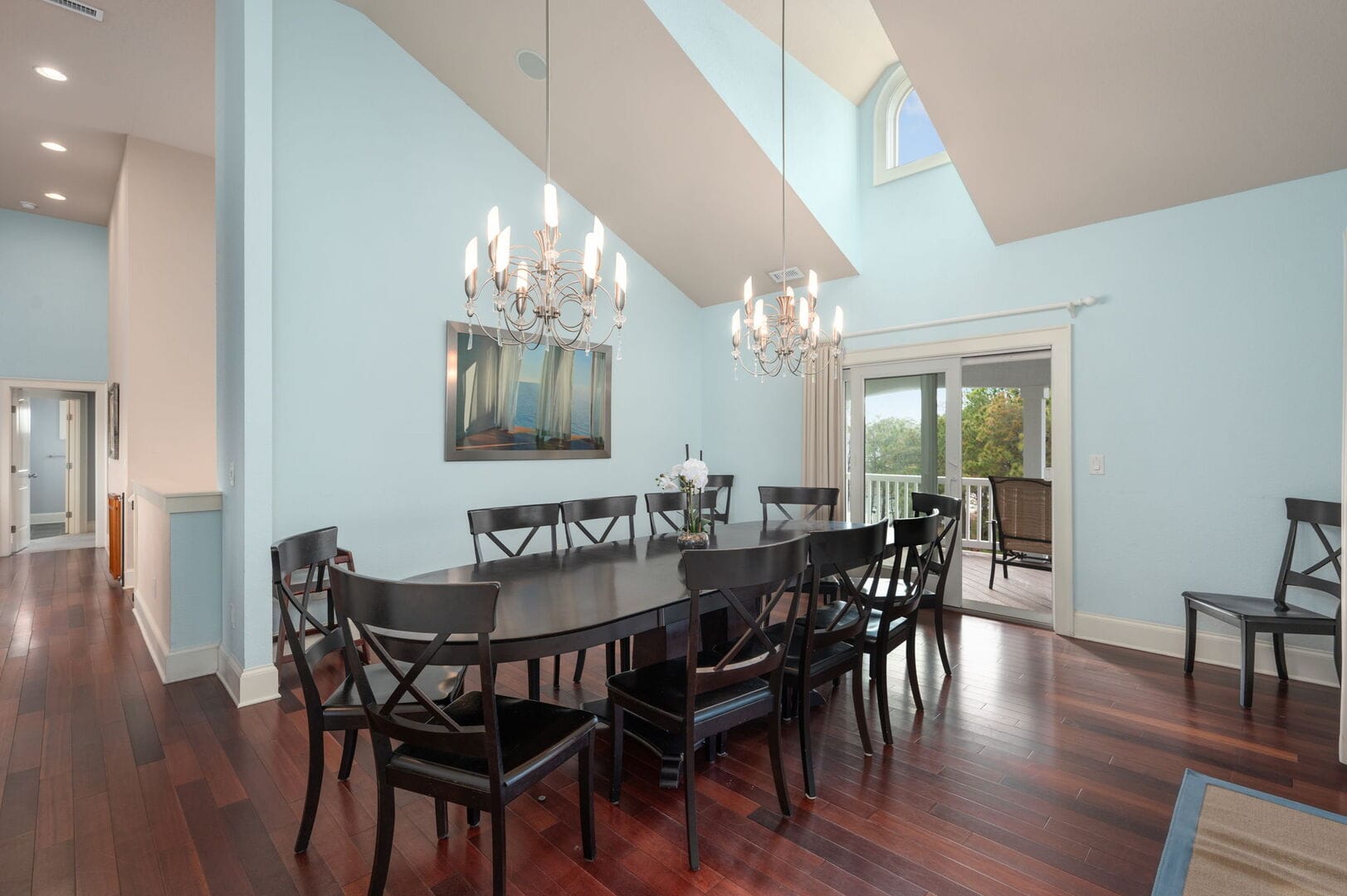 Elegant dining room with chandeliers.