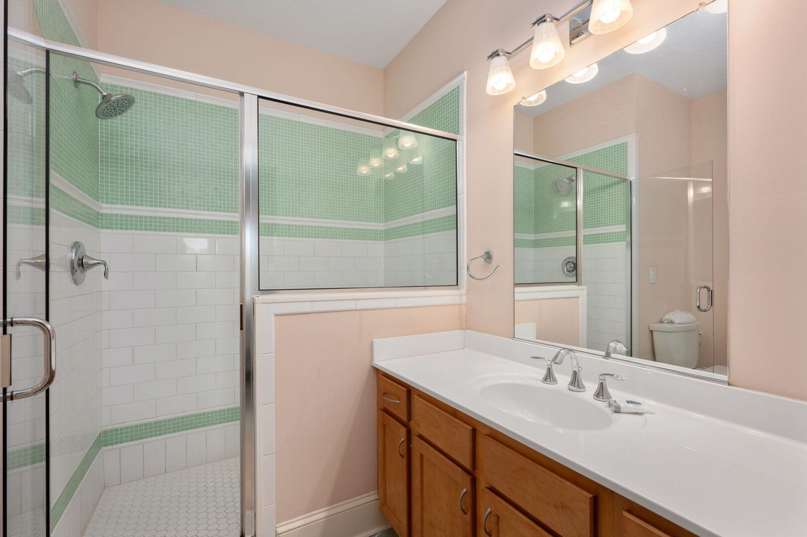 Bathroom with shower and vanity.