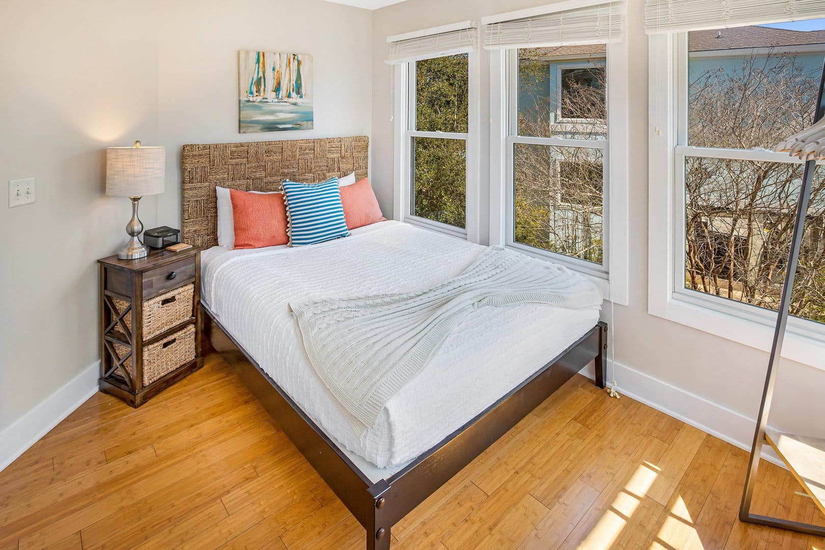 Bright bedroom with large windows.