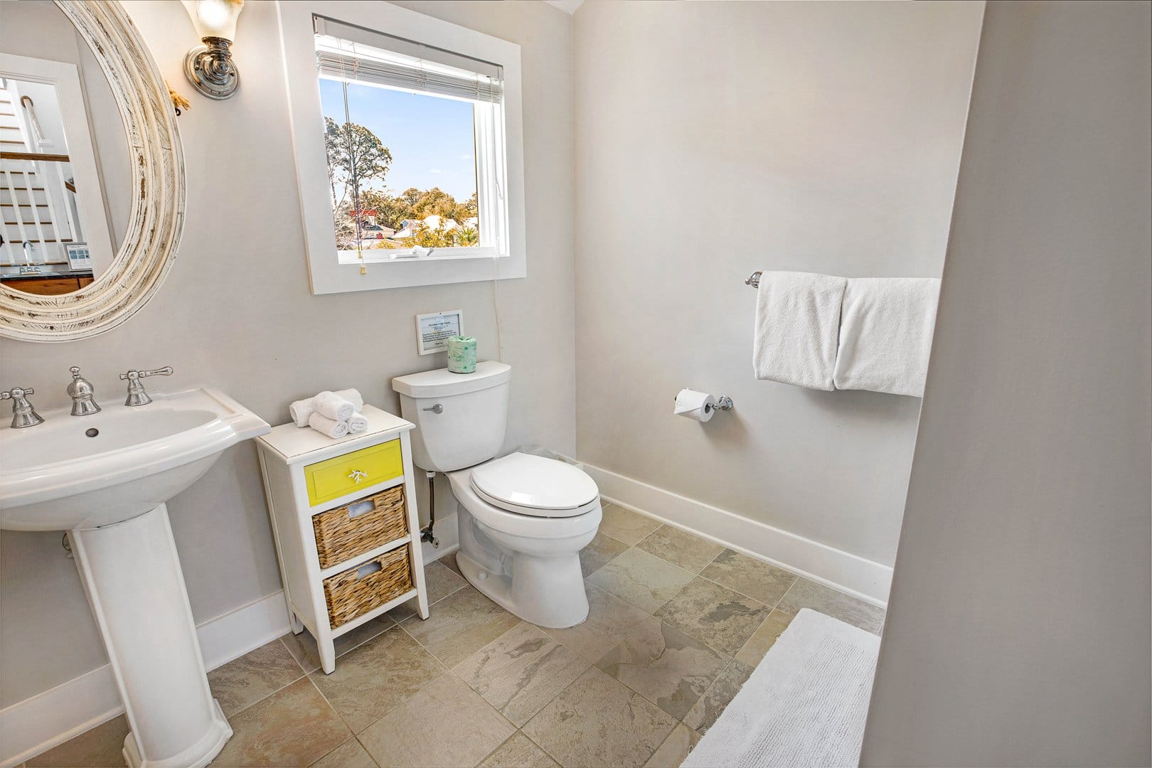 Bright bathroom with window view.