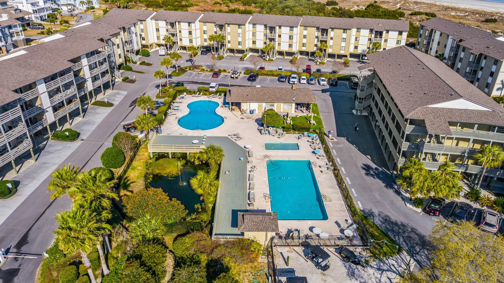 Aerial view of resort with pools.