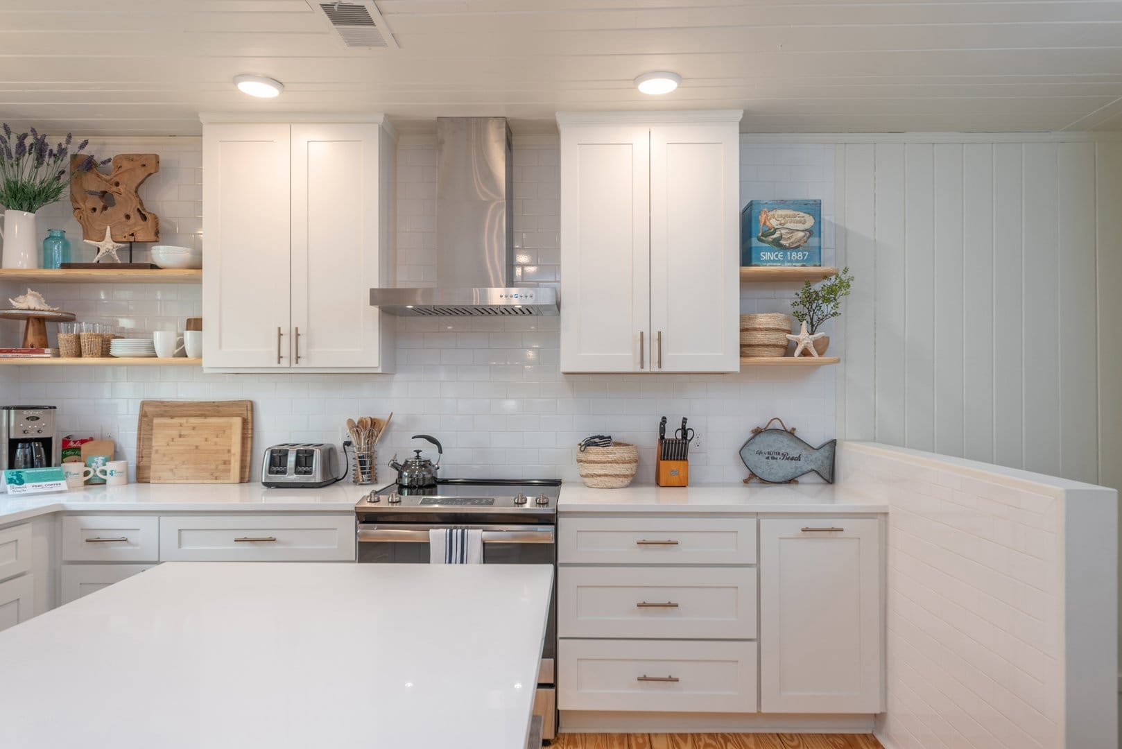 Modern kitchen with white cabinets.