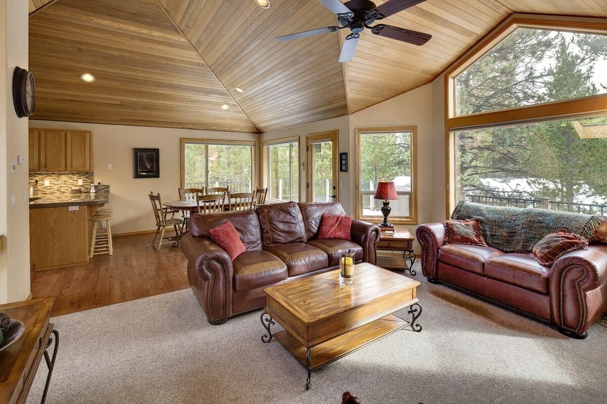 Cozy living room with wooden ceiling.