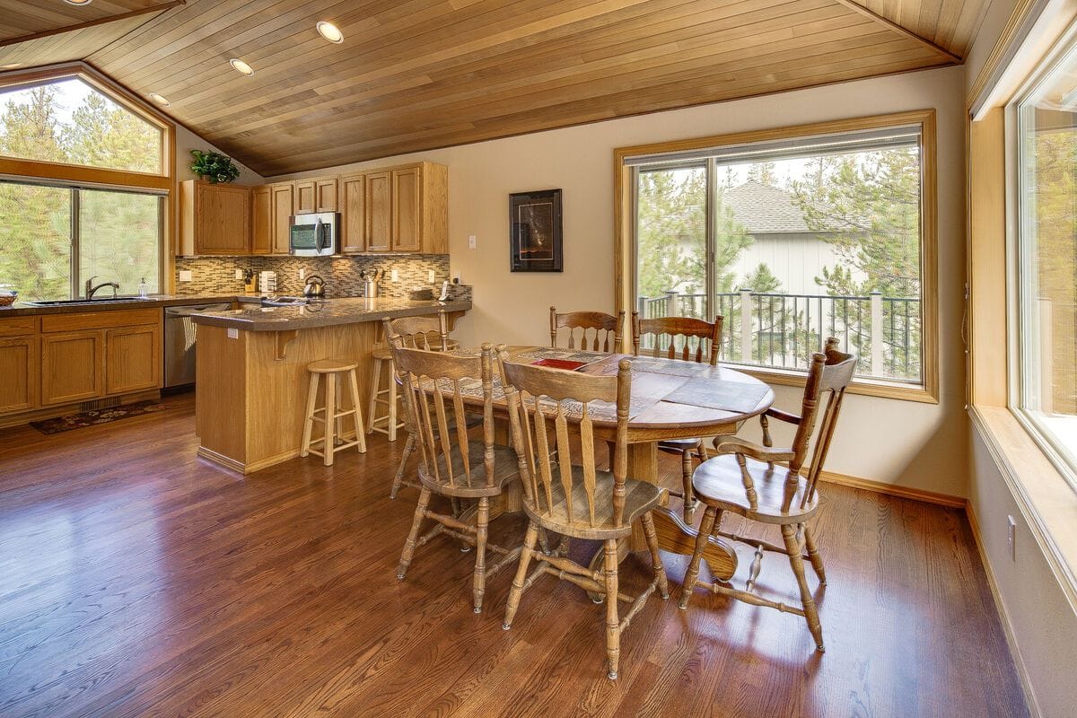 Wooden kitchen with dining table.