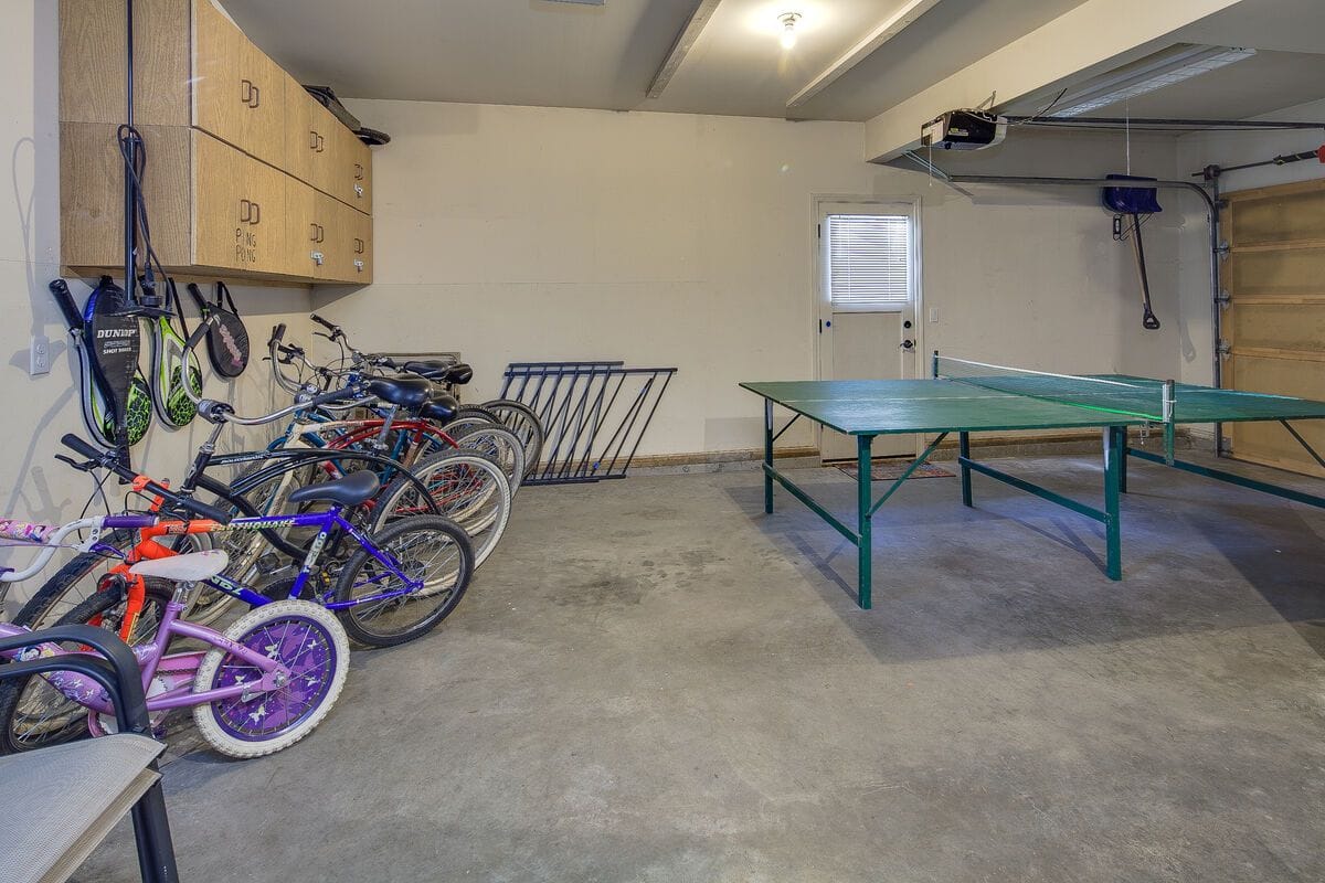 Garage with bikes and ping pong.