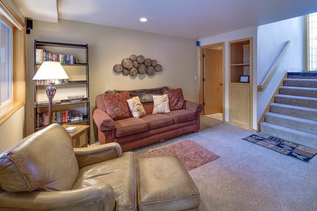 Cozy living room with stairs.