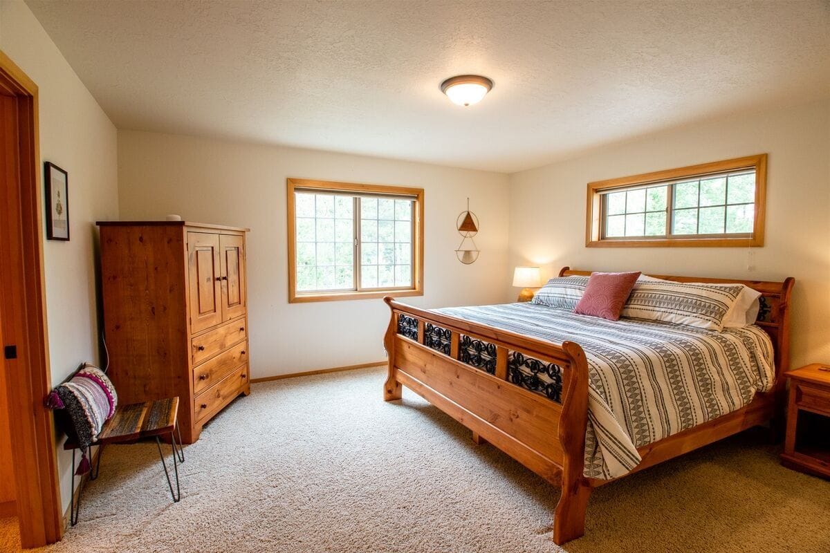 Cozy bedroom with wooden furniture.