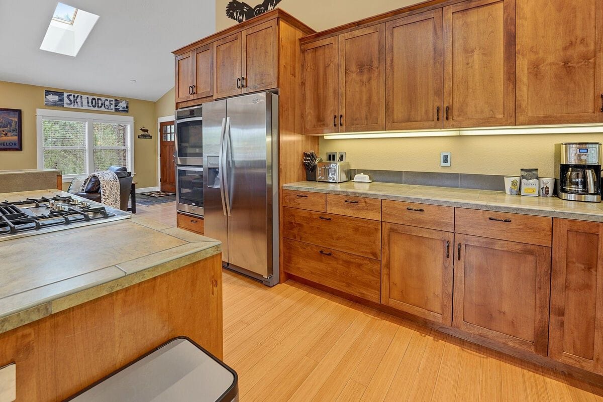 Kitchen with wooden cabinets and appliances.