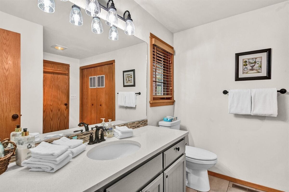 Modern bathroom with vanity and mirror.