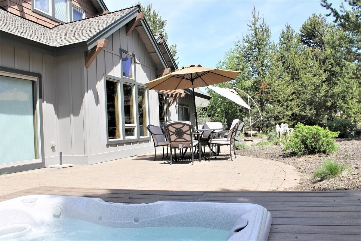 Patio with table and jacuzzi.