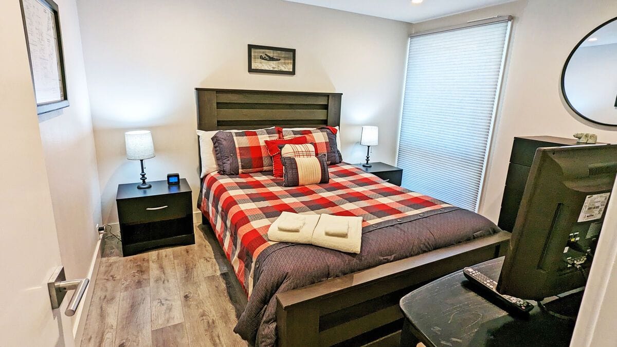 Cozy bedroom with plaid bedding.