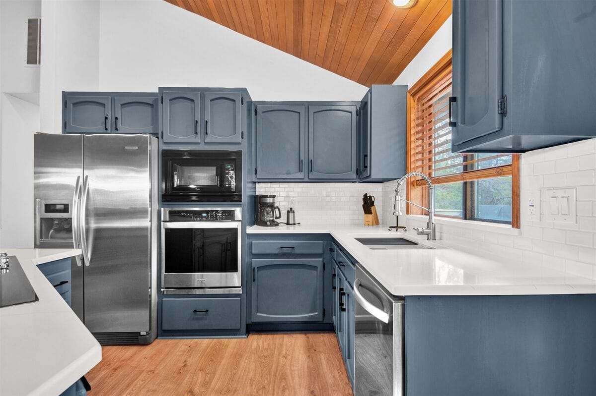 Modern kitchen with blue cabinetry.