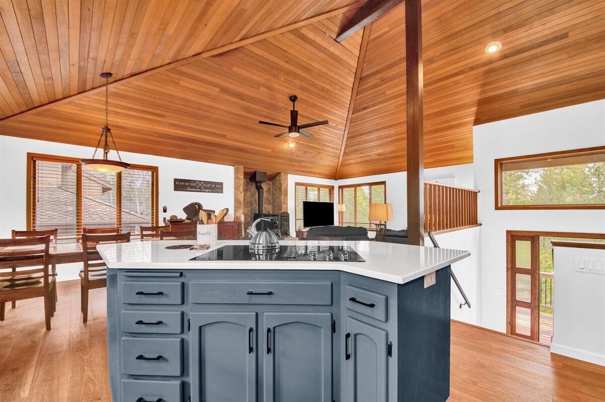 Modern kitchen with wooden ceiling.