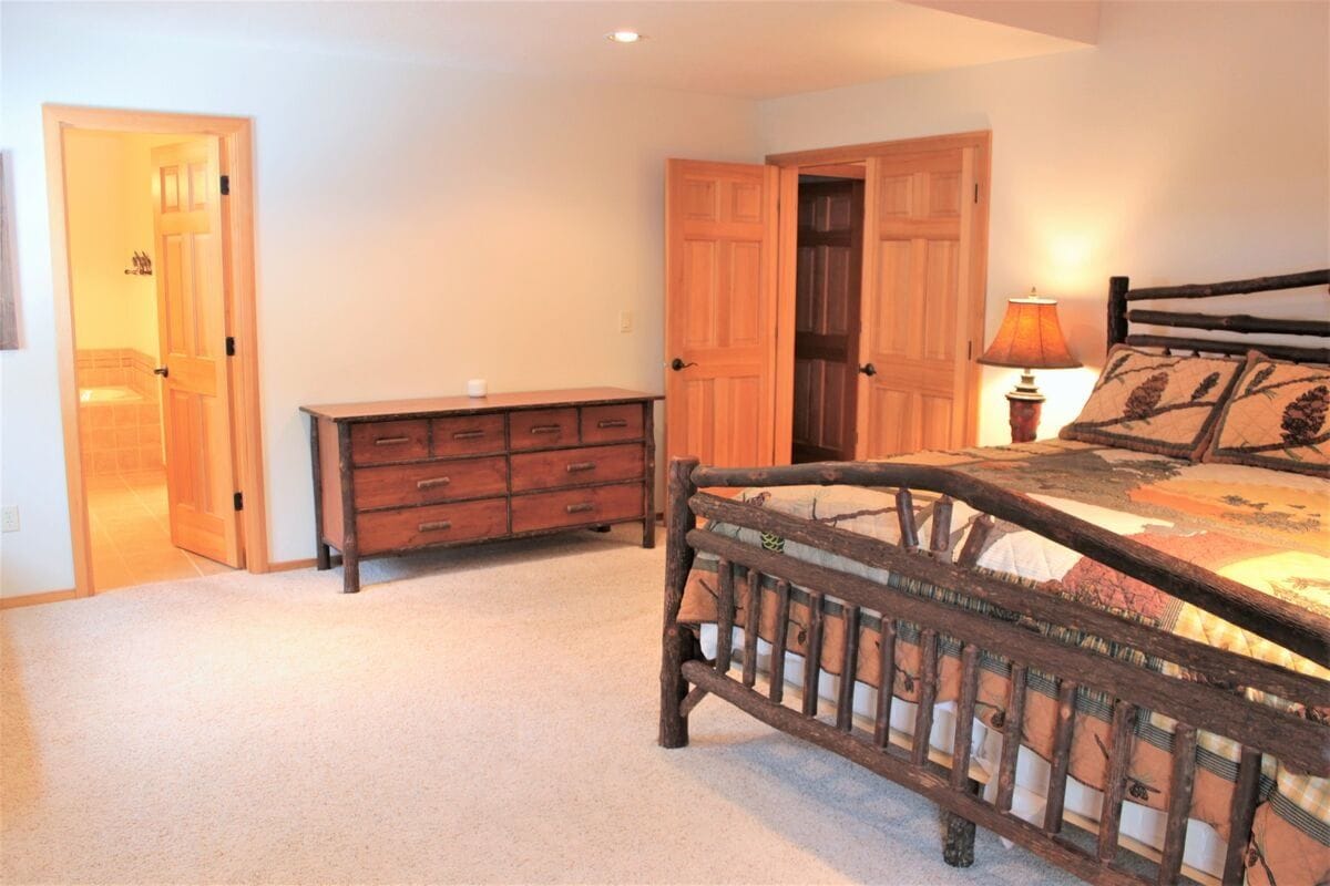 Rustic bedroom with wooden furniture.