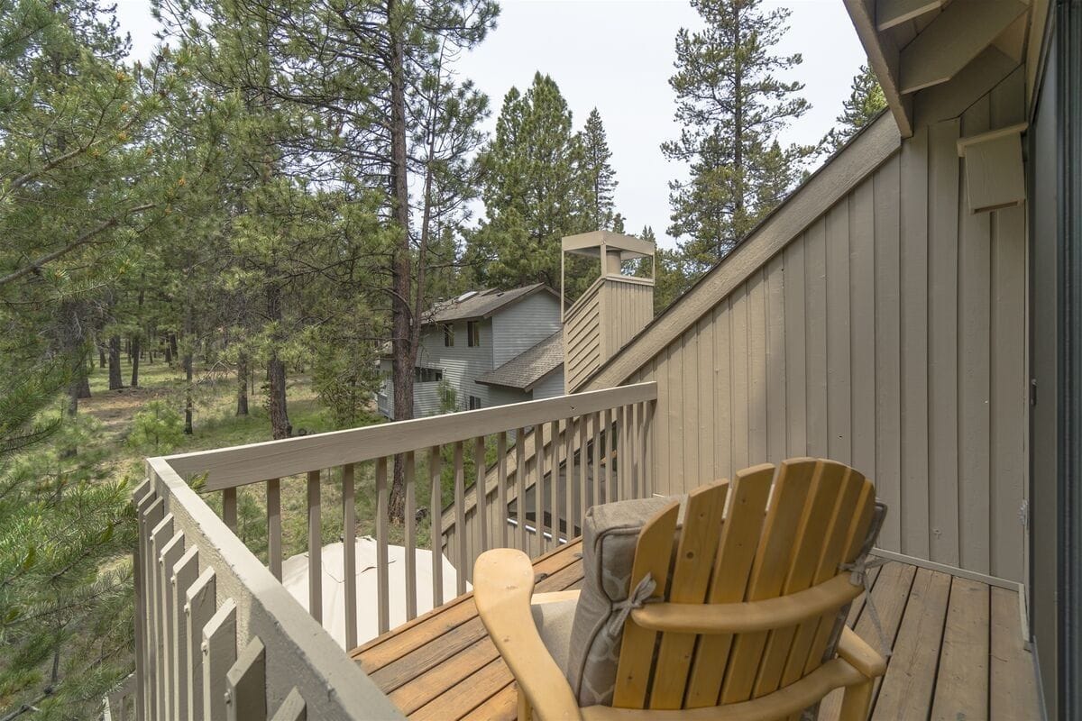 Balcony view of forested area.