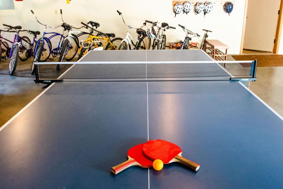 Ping pong table with paddles.