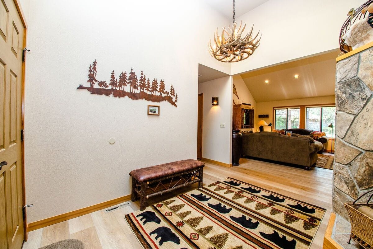 Rustic living room with antler chandelier.