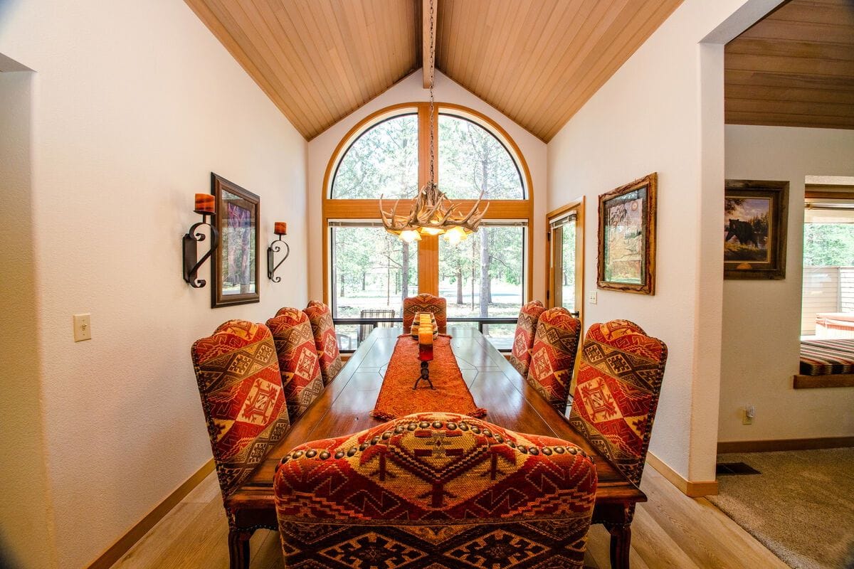 Rustic dining room with large window.