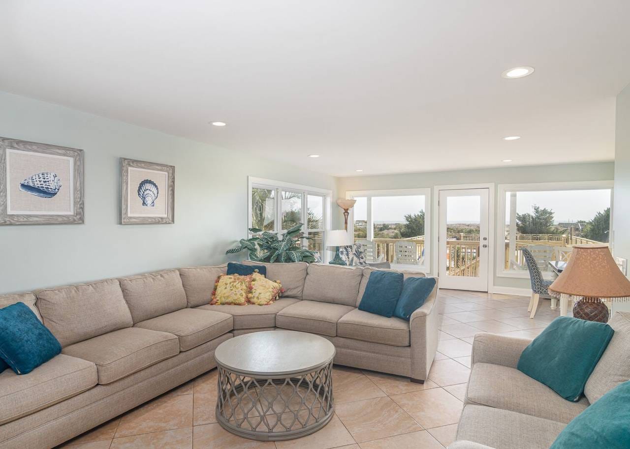 Bright living room with large windows.