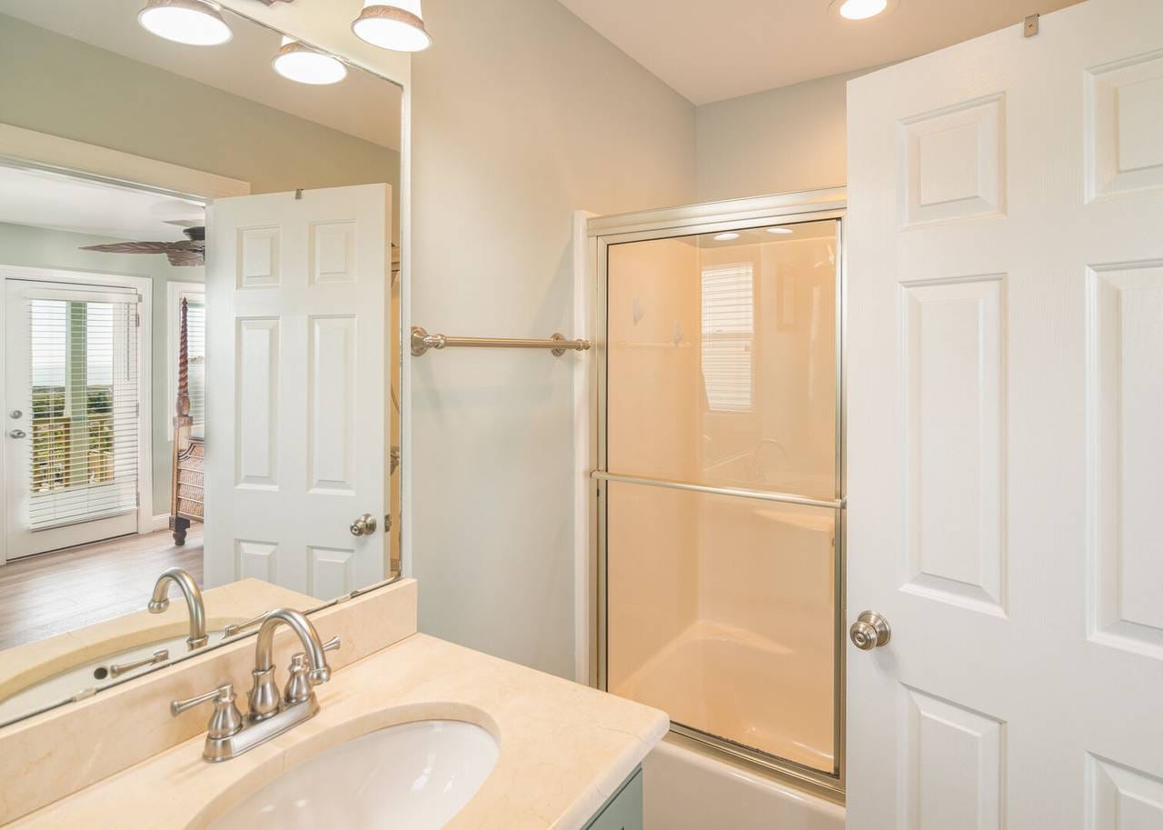 Bathroom with shower and sink.